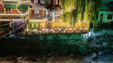 a river running through a city at night