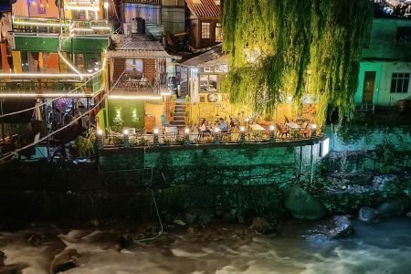 a river running through a city at night