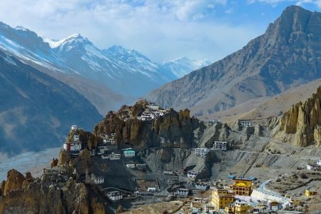 white and brown houses on mountain under blue sky during daytime